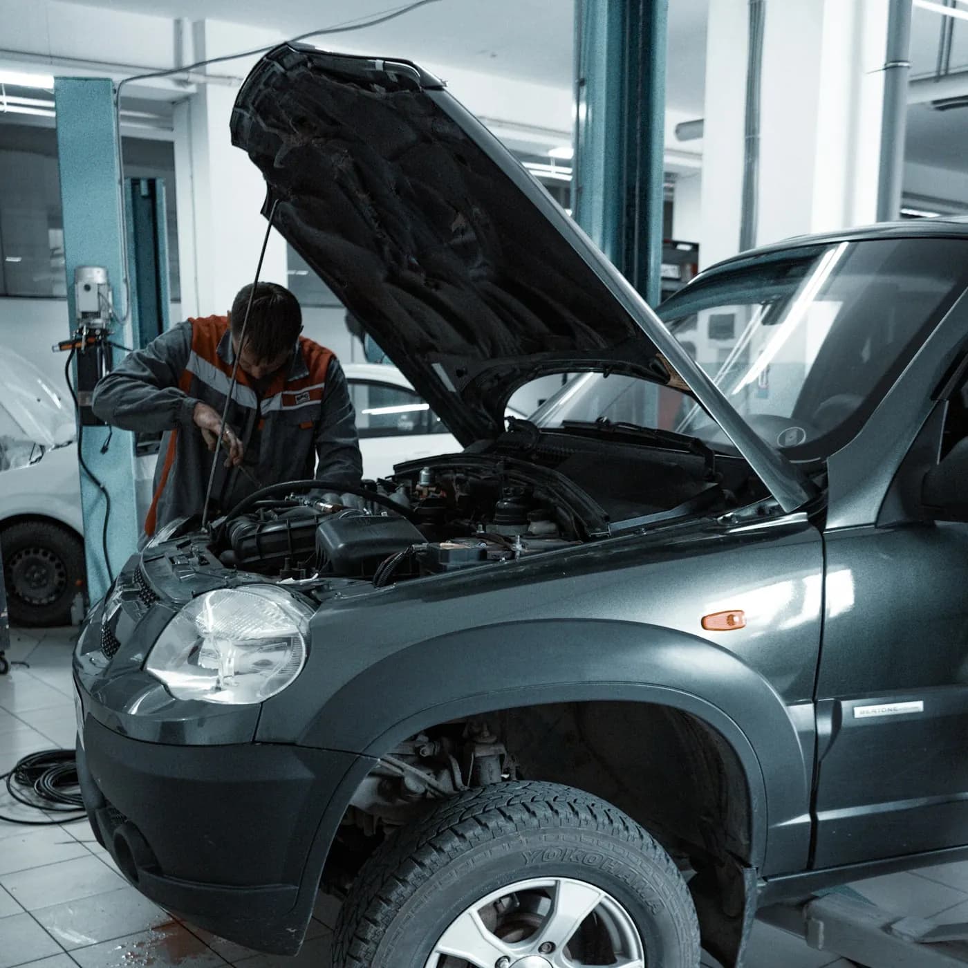 Technician at work inside the Dubai Car Repairs workshop